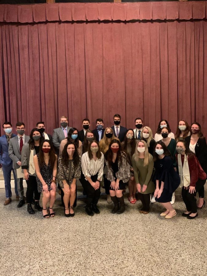 Sorority and Fraternity members pose together at the Order of Omega initiation.