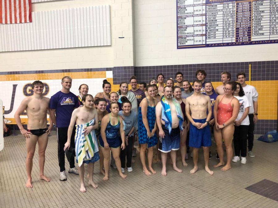 Ashland and Special Olympics swimmers pose together to celebrate a successful practice.