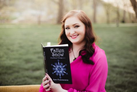 Farnsworth pictured with her third book Fallen Snow in the Evergreen trilogy.