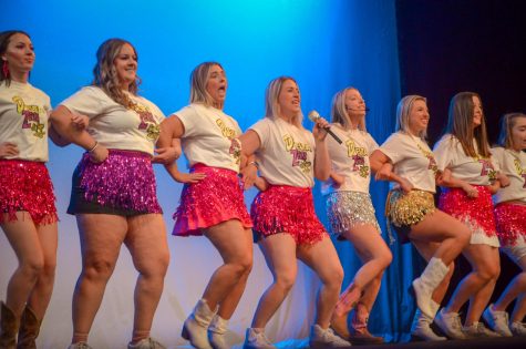 Delta Zeta forms a kickline decked out in Hannah Montana themed attire.