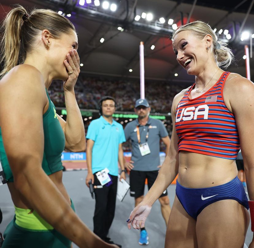 Moon and Kennedy react face-to-face with one another as they accept the medal together. 