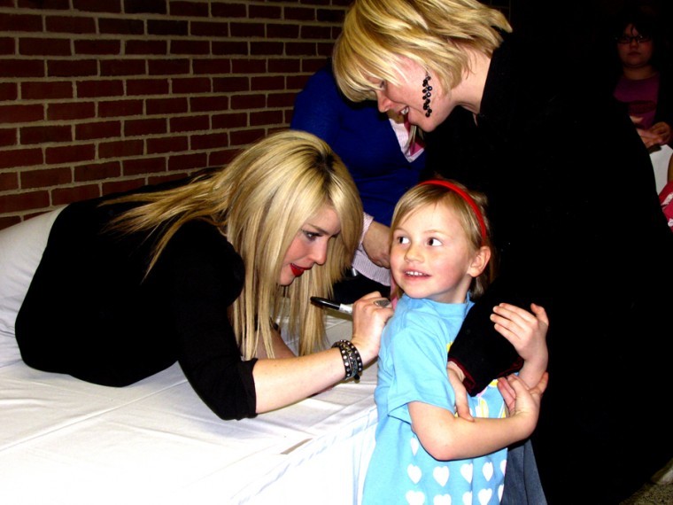 Lauren Barlow, a member of the Christian band BarlowGirl, signs autographs for fans after their concert Feb. 4.