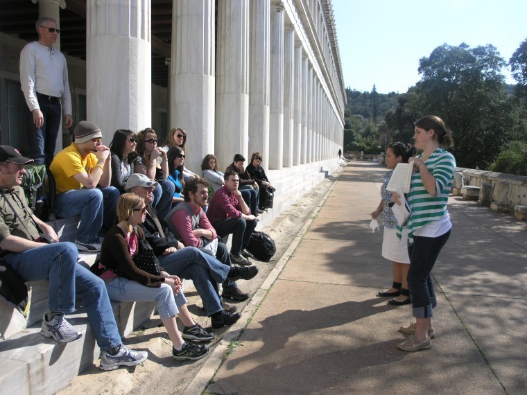 The class listens to a presentation being given at the Stoa of Attalos (outside the Agora Museum) in the ancient Agora in Athens.
