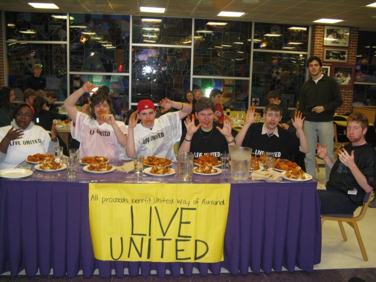 Students competed to see who could eat the most wings in a fundraiser for United Way. From left: Bridgette Love, Malachi Ohara, Chris Dalbow, Chris Manthy, winner Matt Goldsmith, and Ryan Augustitus.