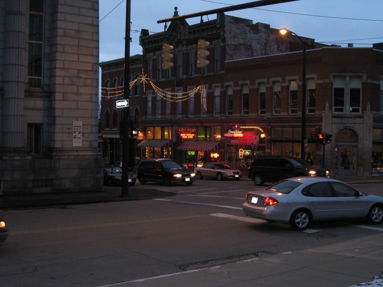 New and old shops alike line Main Street in downtown Mansfield, pictured at night.