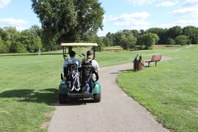 Pictured here: Chris Bils and Glenn Battishill drive down the course.
Not picture: Glenns growing depression or the numerous holes resulting from Chris bad swings.
