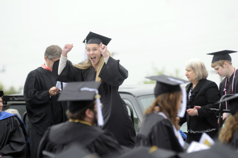 Cassandra Mosley of Brunswick cheers as her name is called during Ashland University's Spring Commencement Saturday, May 11, 2013 at Jack Miller Stadium.