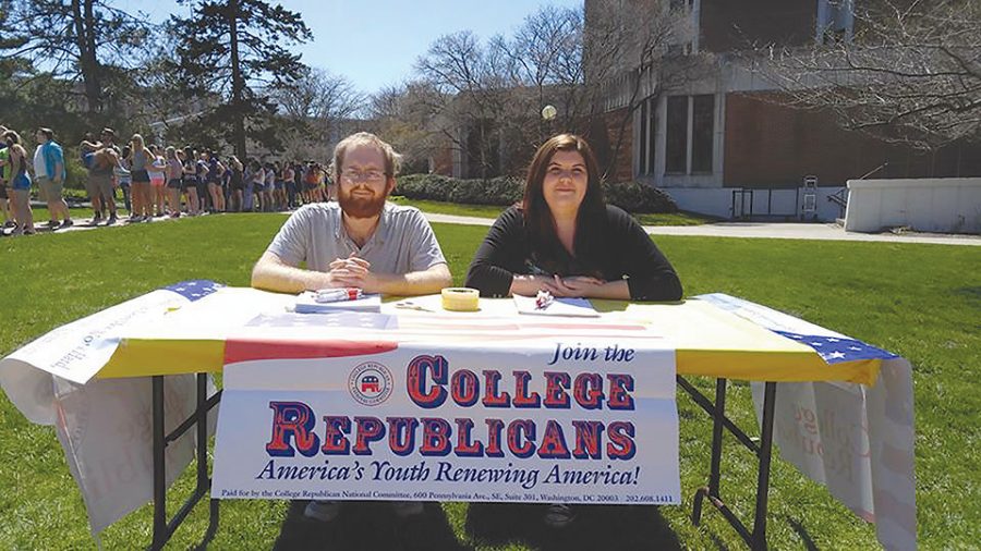 College Republican club members Ivan Larson and Jessica Frichtel advertise and recruit other Ashland students to their club. 