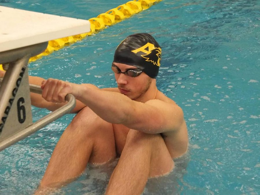 Senior swimmer Keegan Goeke gets set for a race last season.