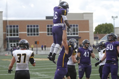 Ronald Lee (16) celebrates with Jack Holl (47) after a 3-yard touchdown run against Michigan Tech