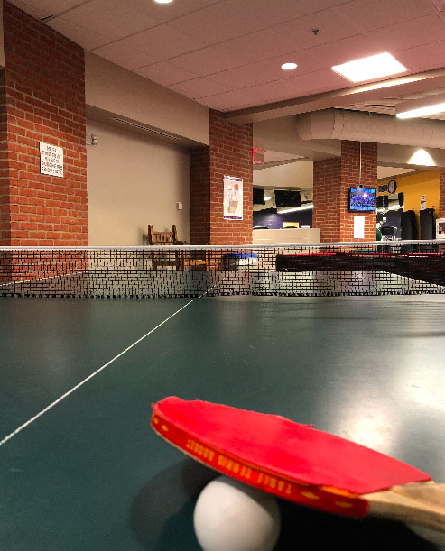 Students can play ping pong with their friends on the lower level of the rec center