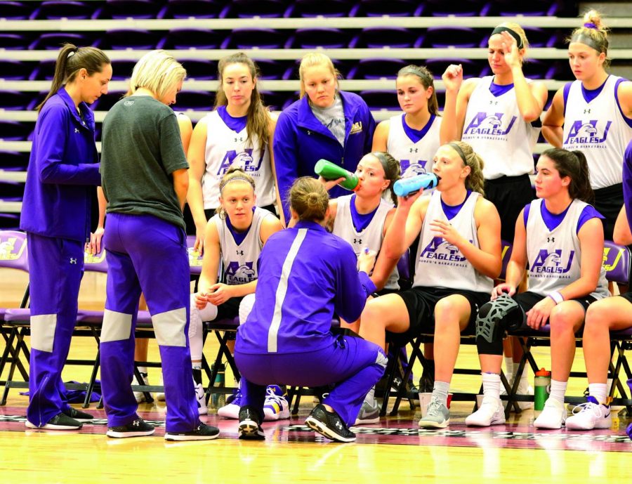 Pickens+talks+to+her+team+in+a+huddle+during+the+teams+first+scrimmage+on+Oct.+19.