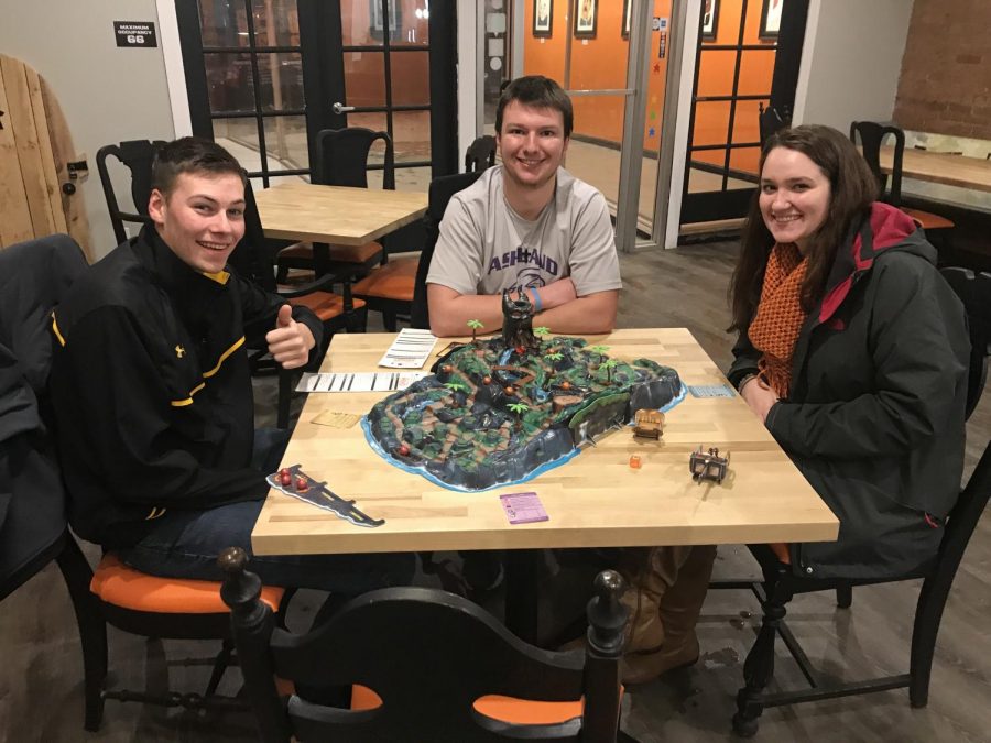 From left to right: Lewis Markham, Zach Read and Elizabeth Grim playing Fireball Island at Masterminds