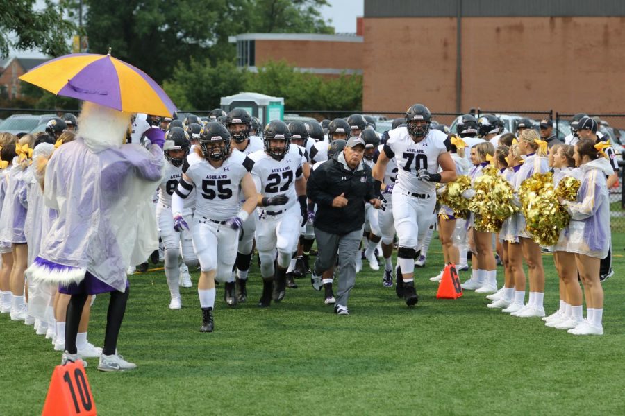 The Ashland University football team runs out onto the field prior to a game against Ohio Dominican in 2018
