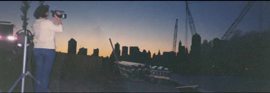 Photo taken by Jess Baker of her classmate Laura Allenbaugh shooting the Manhattan skyline on Sept. 12, 2001, one day after the World Trade Centers fell.