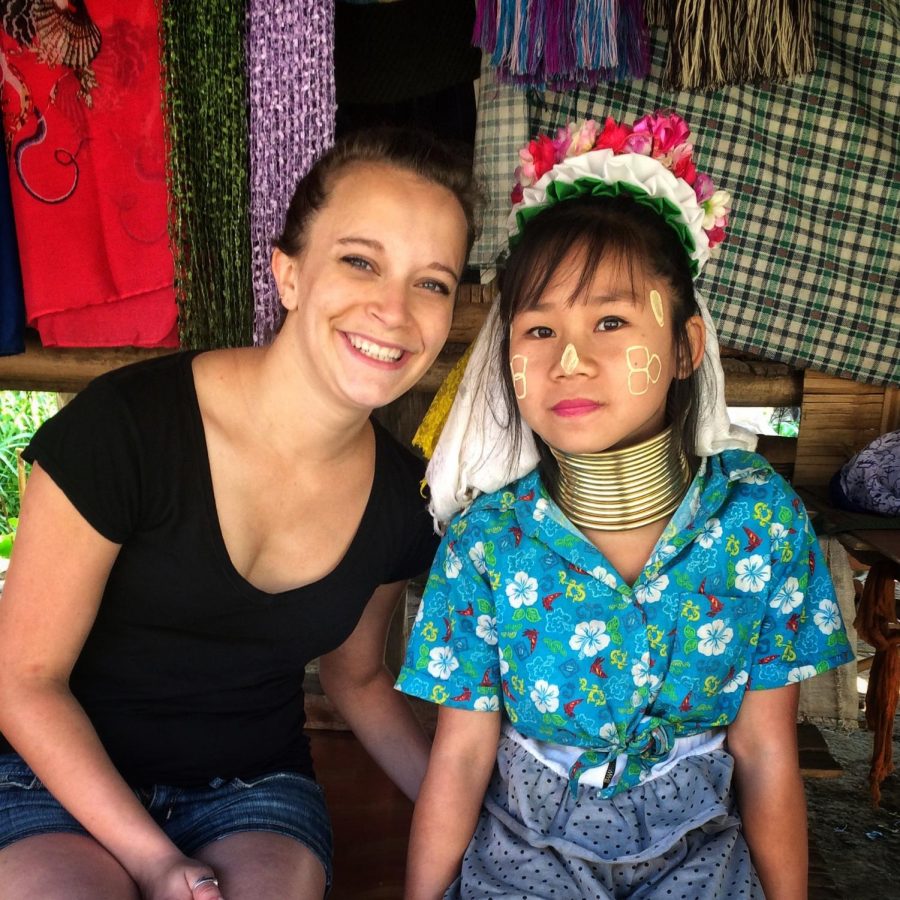 Tracy St. John with a child in Chiang Mai, Thailand.