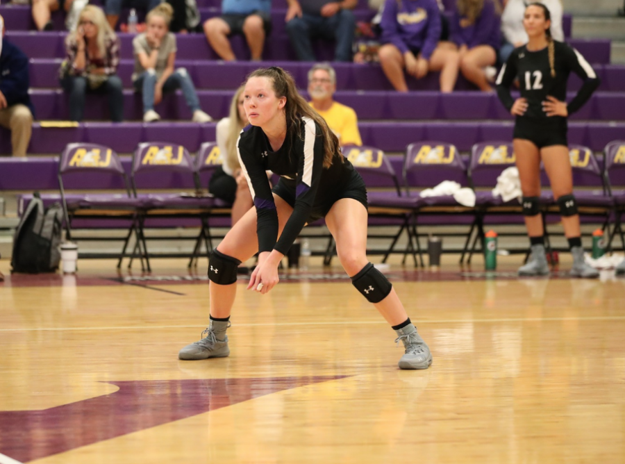 Sophomore Zoey Peck prepares to return a spike during a match against Fairmont State