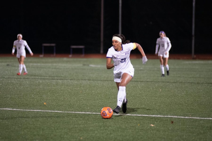 Senior forward Deijah Swihart drives down the pitch against Grand Valley State University