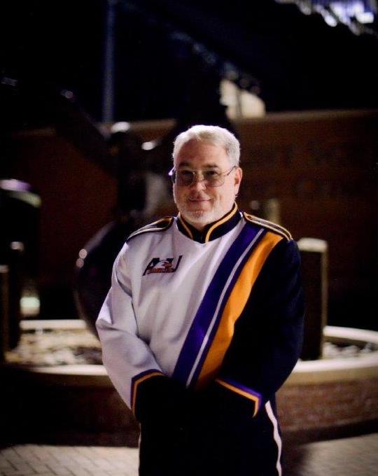 Frank poses in his marching band uniform. 