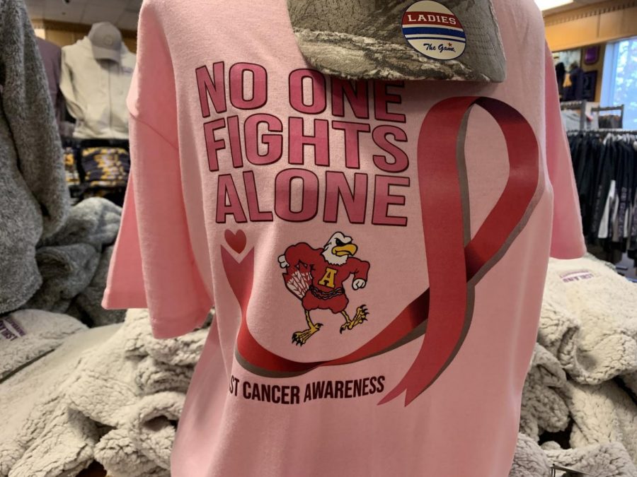 The No one fight alone tee is for sale at the book store.
