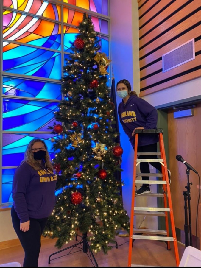 A pair of volunteers putting up a Christmas tree decoration at
the Kroc Center in Ashland back in 2021.