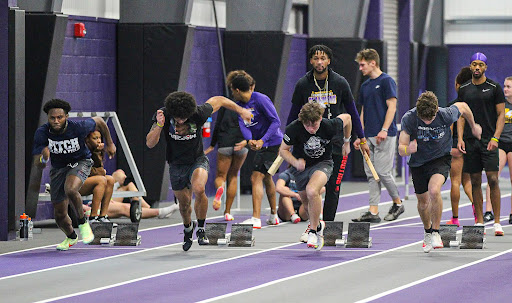 Ashland runners practice their starts in the Niss Athletic Center. The Niss was home to the inaugural Jud Logan Light Giver Open, in honor of the legendary head coach. 