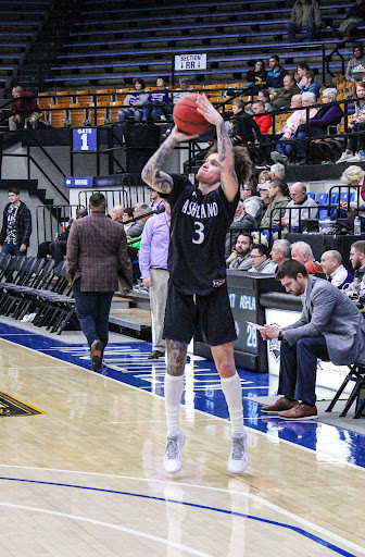 Ashland University guard Tre Baumgardner (3) attempts a three-point shot during the Eagles’ game against the Kentucky Wesleyan Panthers at the Owensboro Sports Center in Owensboro, Kentucky, on Feb. 12, 2022. The Eagles managed to win in overtime 75-71.