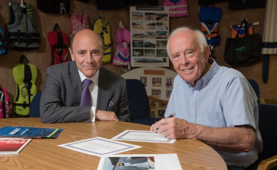 Dr. Carlos Campo and Robert Archer, the CEO of Kent Watersports, which manufactures water skies, wakeboards, personal flotation devices, and other water-related sports gear, meet in Bobs office. 
