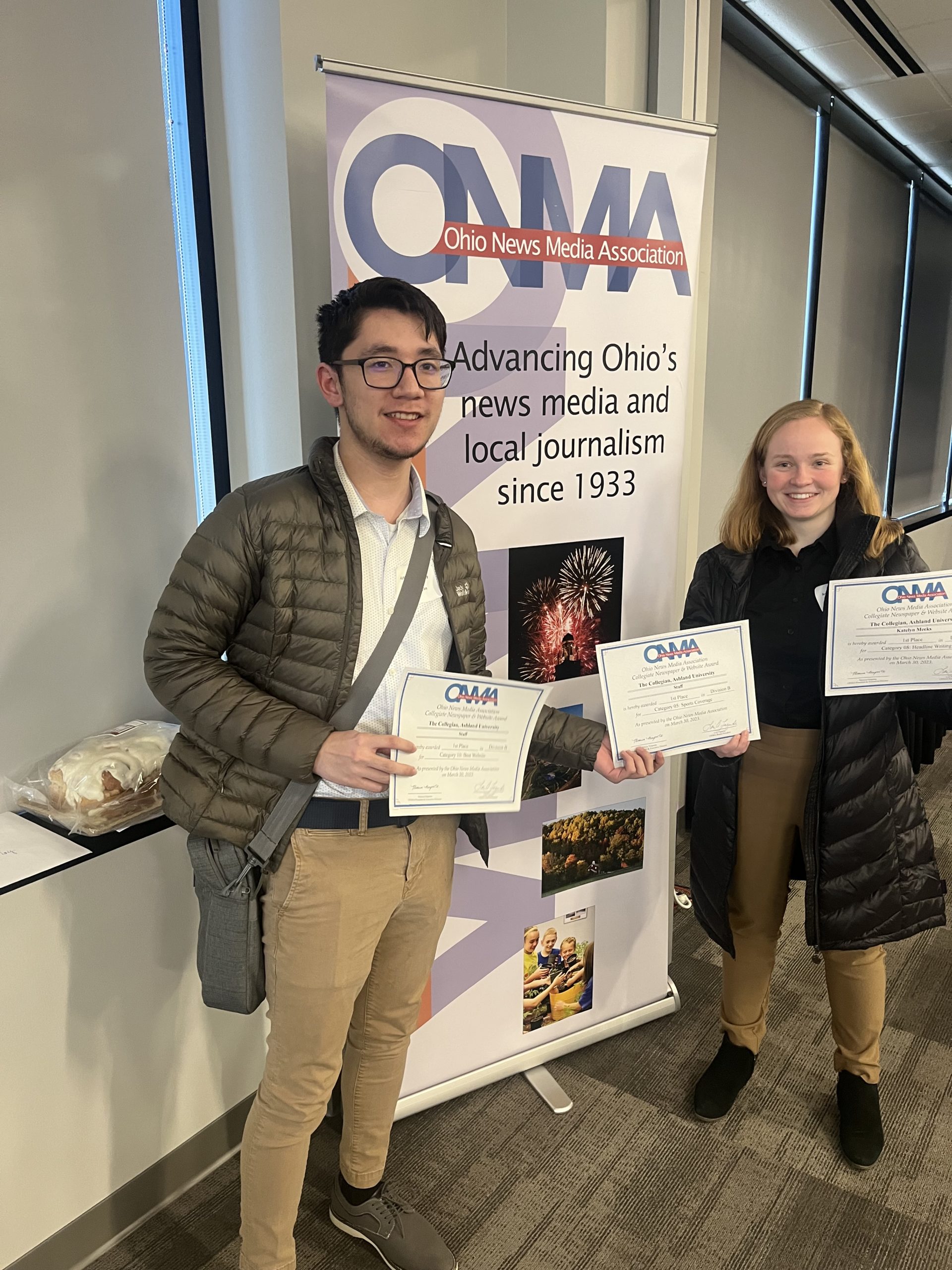 Managing Editor Sean Repuyan and News Editor Katelyn Meeks accept the ONMA awards on behalf of The Collegian.
