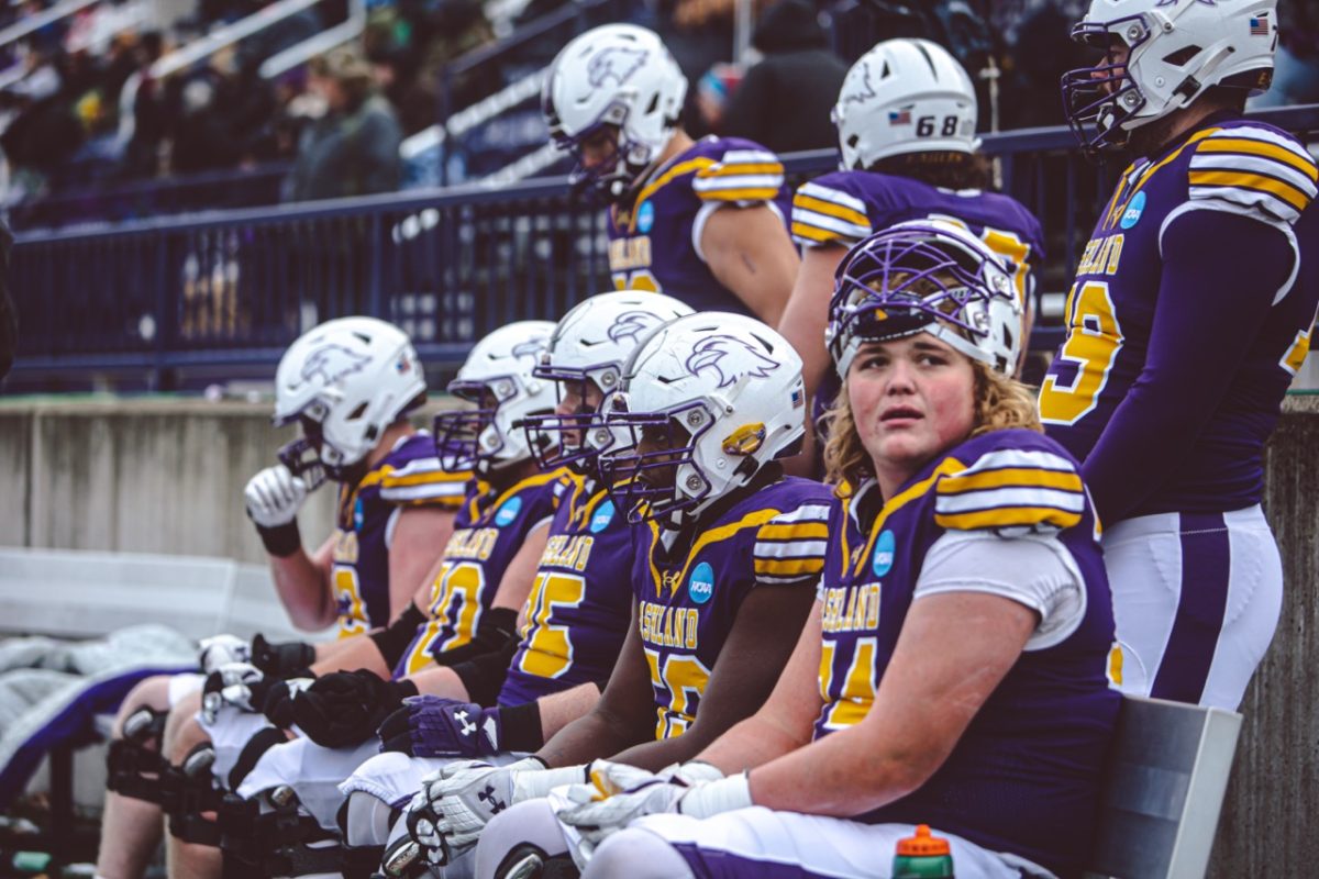 The Eagle offense sit on the bench after running a play against Notre Dame College in the opening round of the 2022 NCAA Division II Playoffs.