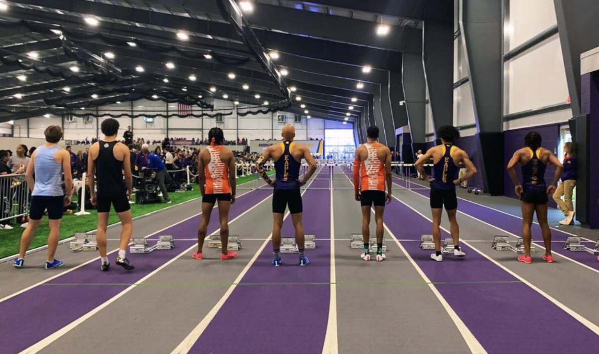 The Eagles line up for a race at a meet inside the NISS Athletic Center. (Retrieved from T.J. Skinners Instagram)