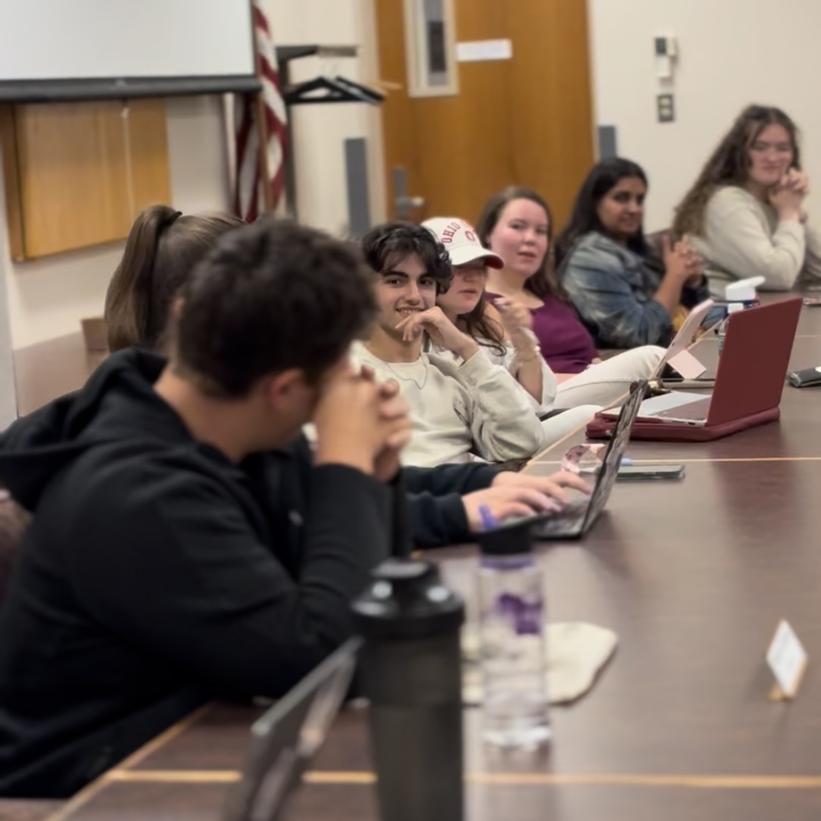 The AU Student Senate sits at meeting, discussing campus issues.