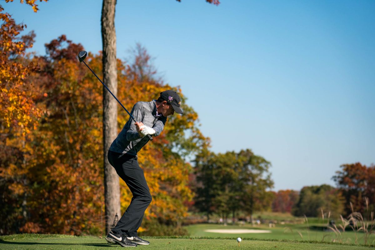 AU men’s golfer playing at tournament.