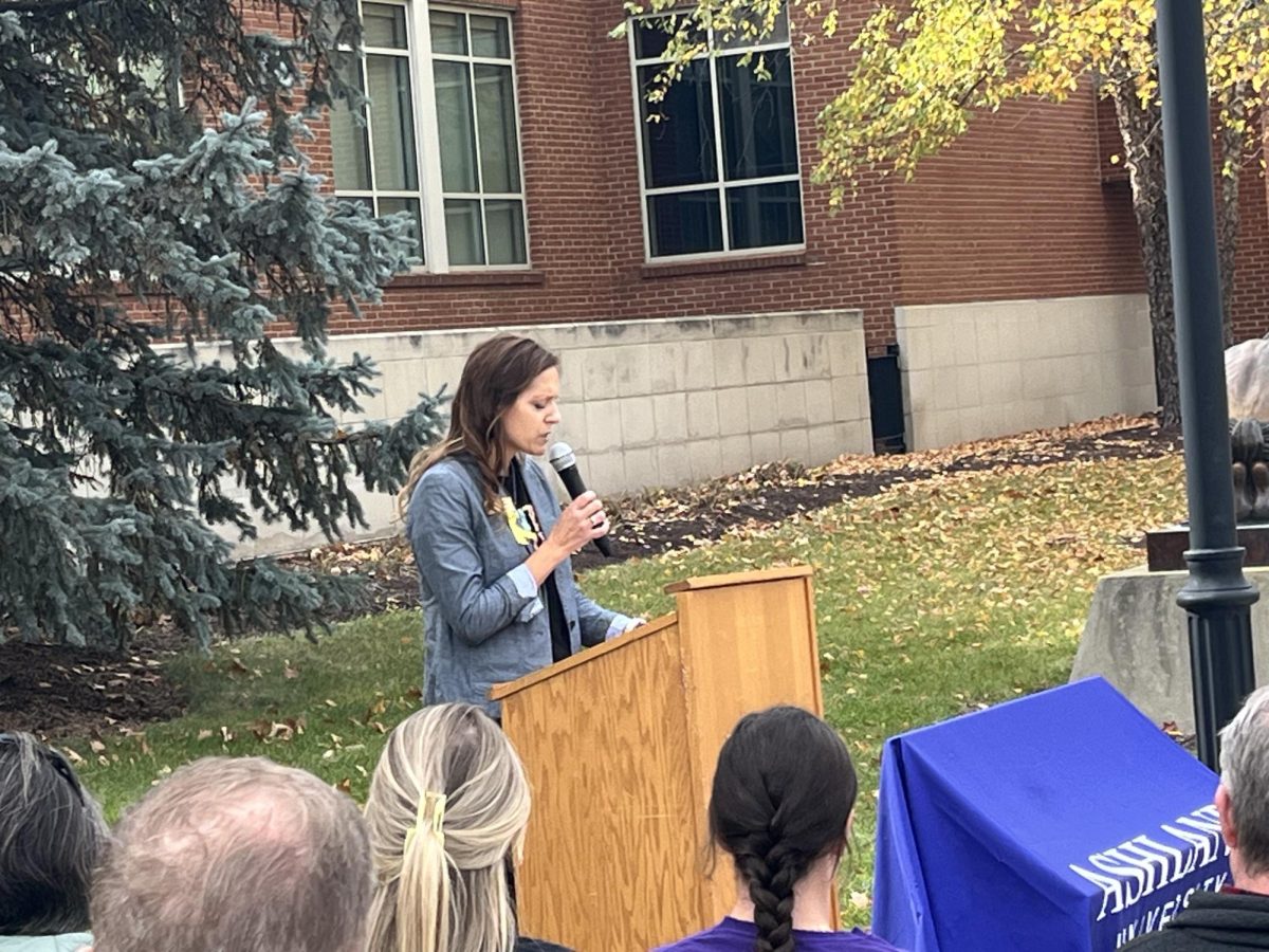 Janel Molnar giving her speech at the bench ribbon cutting ceremony.