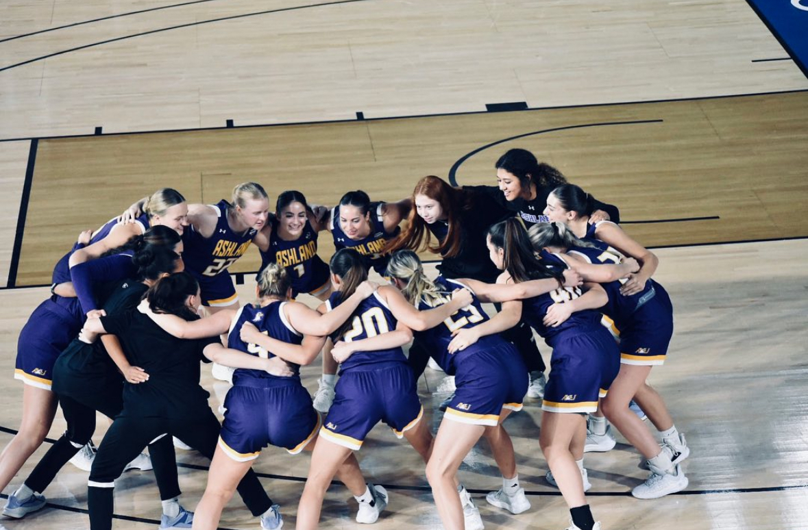 The women’s basketball team gets hyped up prior to the game.