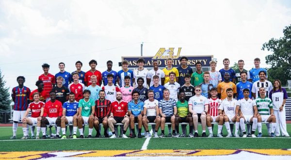 A photo of the Eagles wearing their favorite soccer/futbol teams' kits.