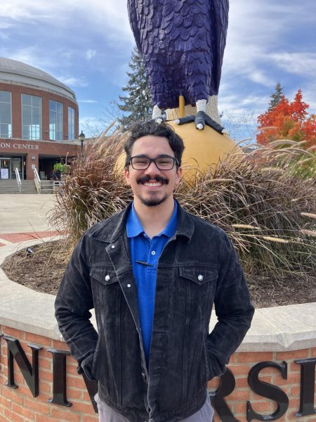 New FSL Director Gabe Del Valle stands in front of the Eagle outside the Recreation Center.