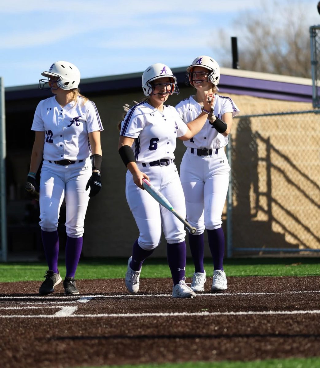 Eagles Sophia Martin, Delaney Maynard and Danielle Robbins celebrating success against Storm. 