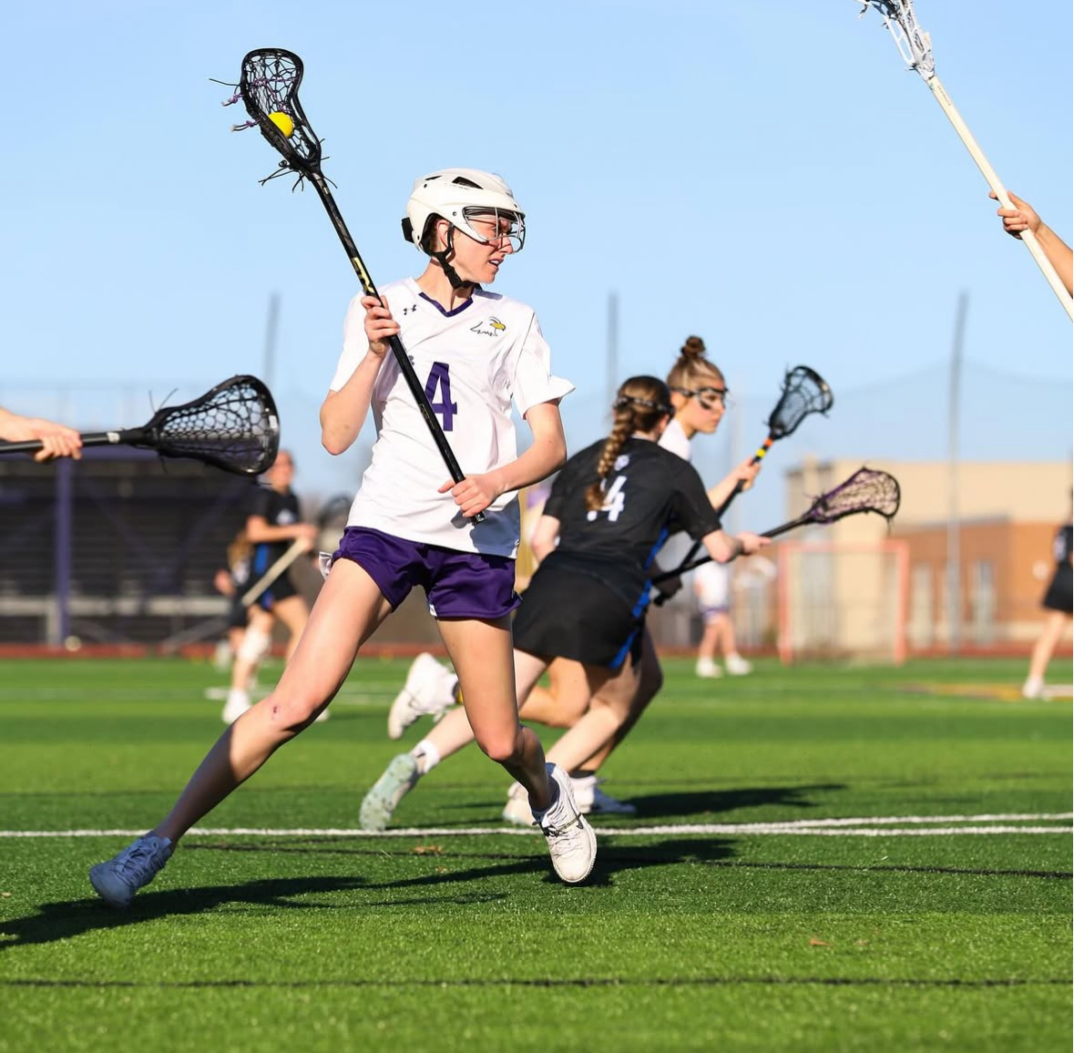 Junior midfielder Ashley Fisher locked in ready to make a play on the field.