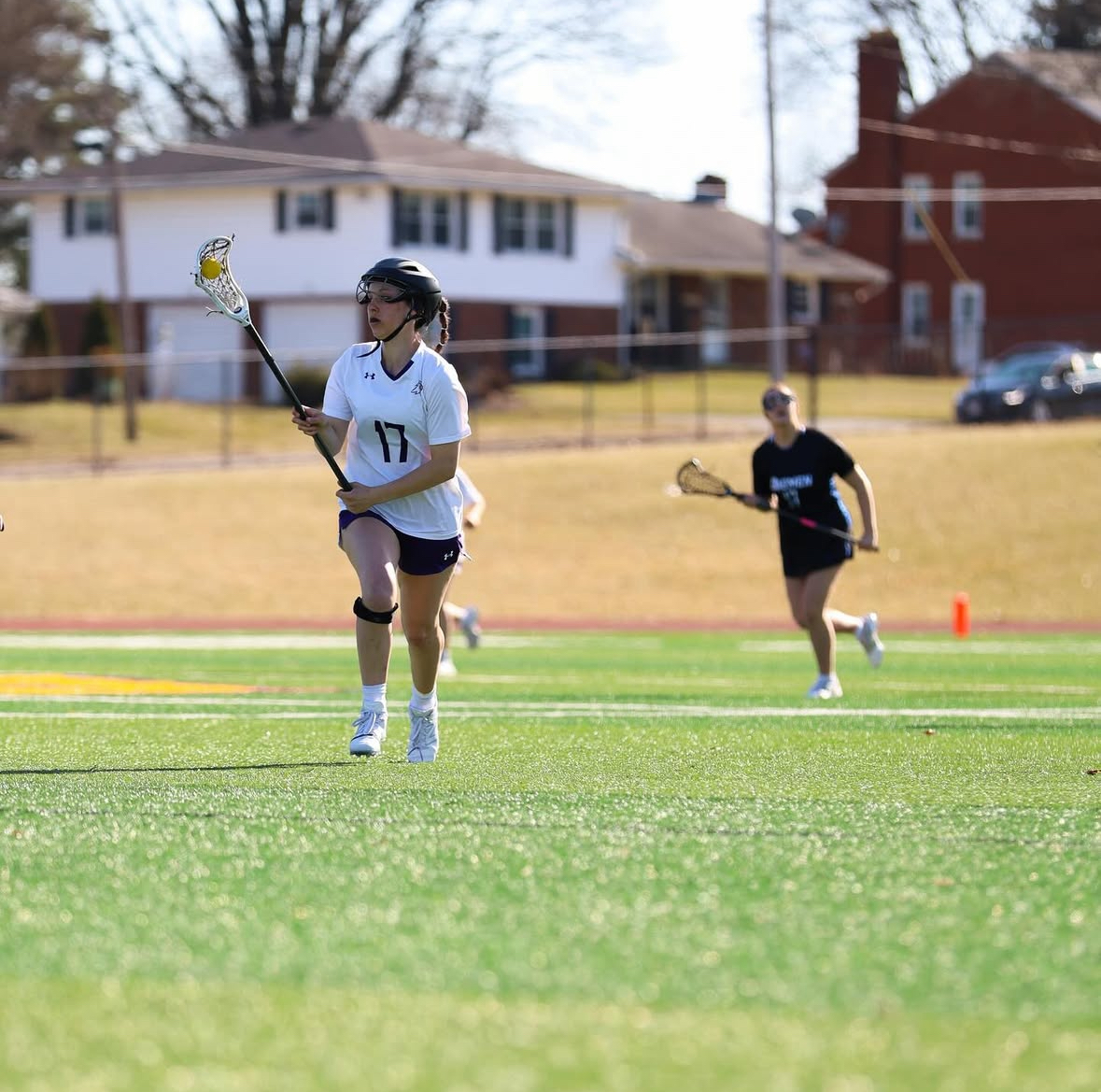 Junior attacker Rachel Crumbacher charging down the field in hopes to score on the Lakers.