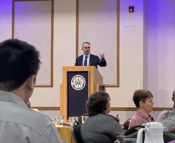 Dr. McBrayer, interim provost, speaking at the luncheon.