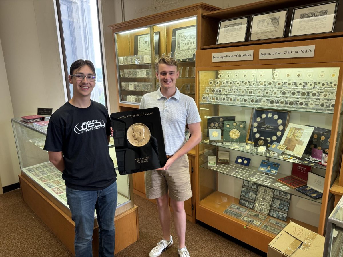 Chief Curator David Maloney, and Evan Koren, showcase the numismatic center's oldest collection.
