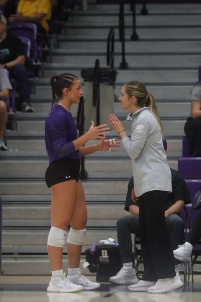 Sophomore Sophia Samonek talking with Coach Katie Kuhn
