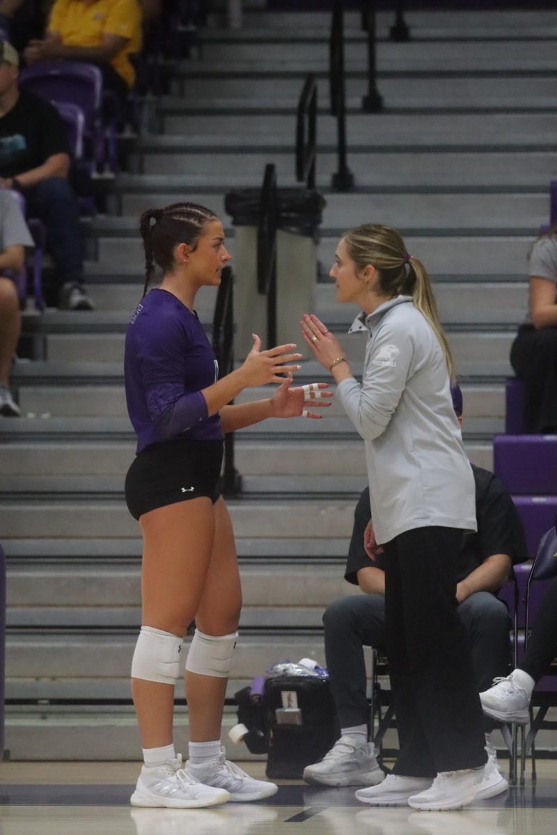 Sophomore Sophia Samonek talking with Coach Katie Kuhn