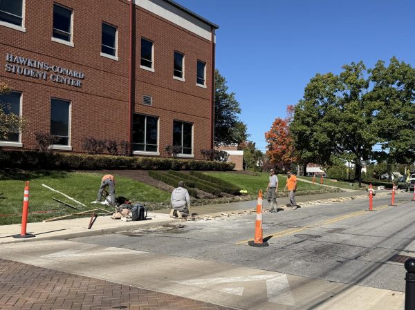 The contractor’s crew levels the concrete slabs on Oct. 16.