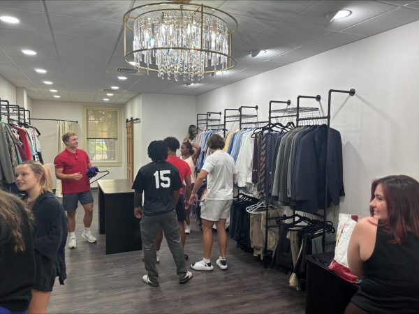 Students walking through the closet looking for business items.