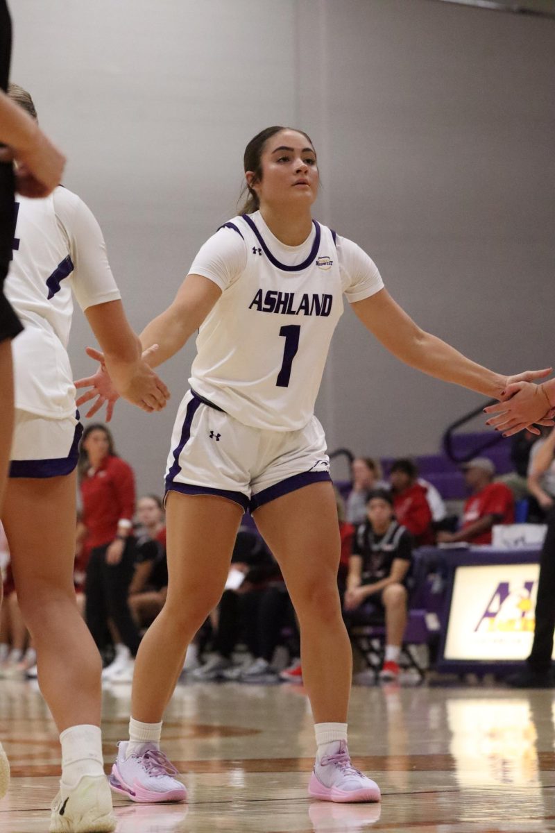 Sophomore Ashley Mullet high fiving teammates after making a free throw.