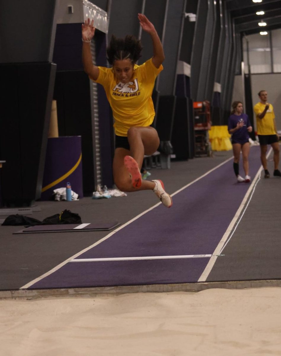 Sheppert practicing long jump at practice leading up to the invite.