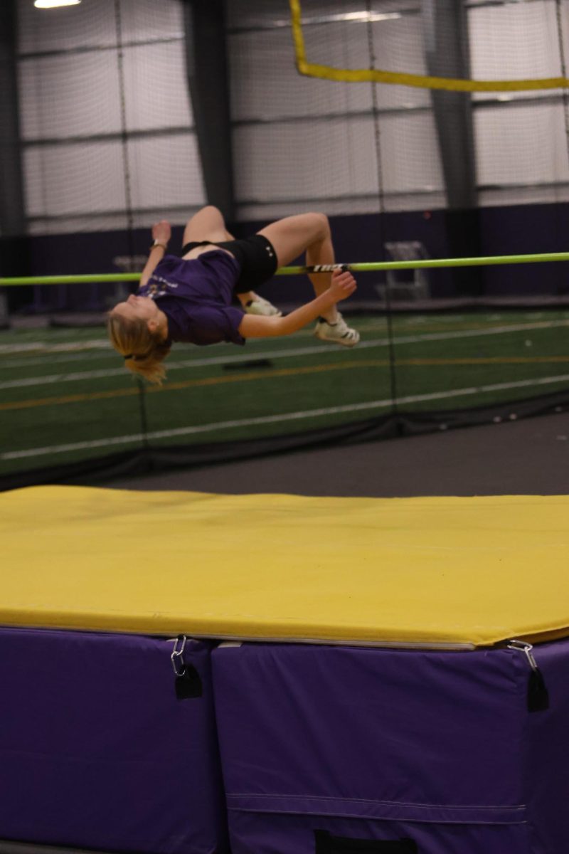 Junior Abigail Hartzler clearing her jump at practice.