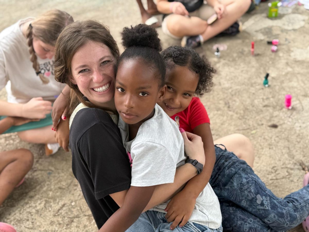Senior Danielle Robbins with a new friend that she made on the trip.